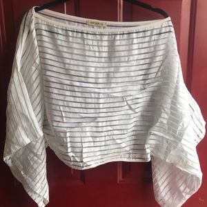 Sheer white hanging sleeve crop top.